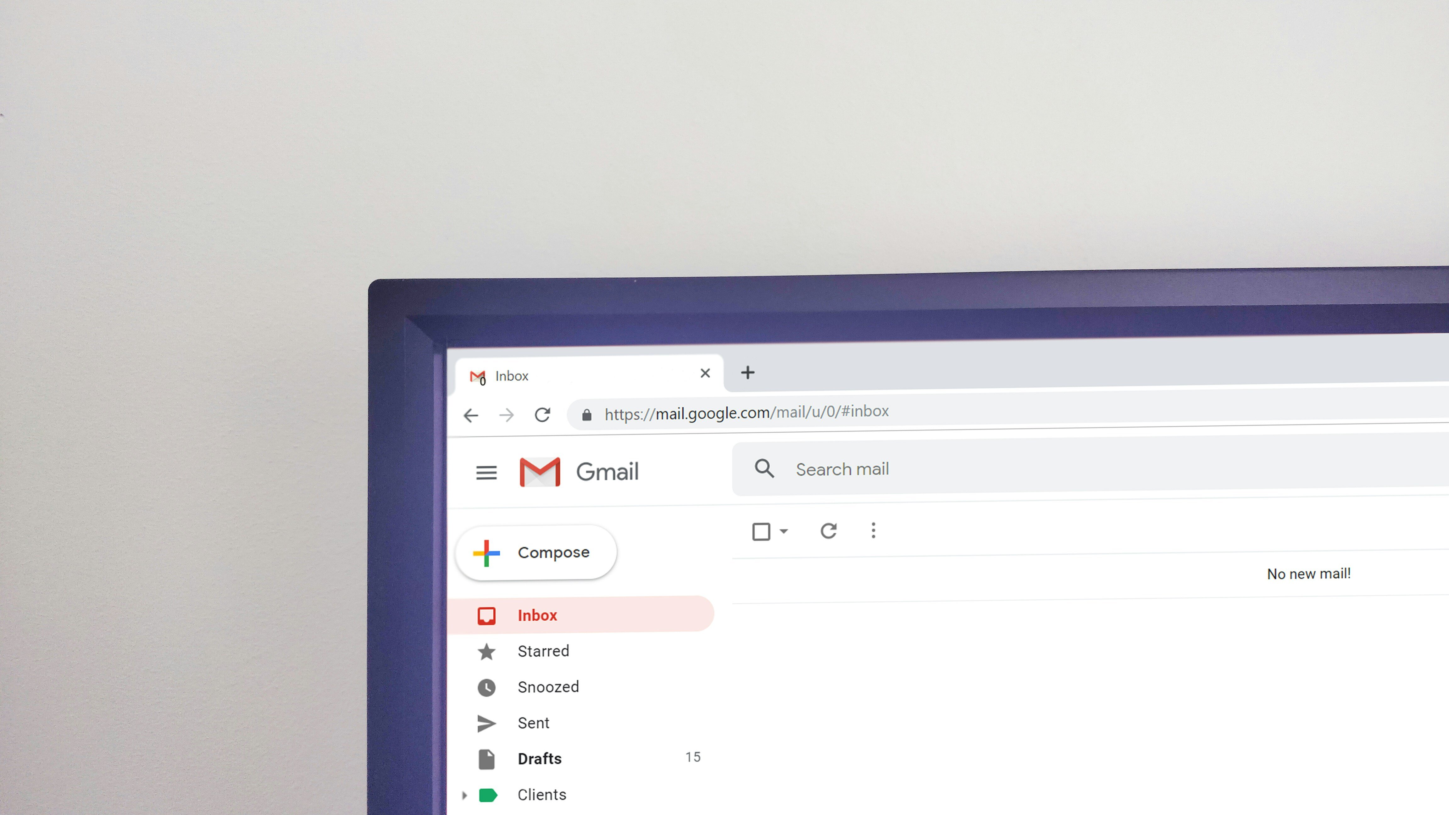 Corner of a laptop showing gmail open